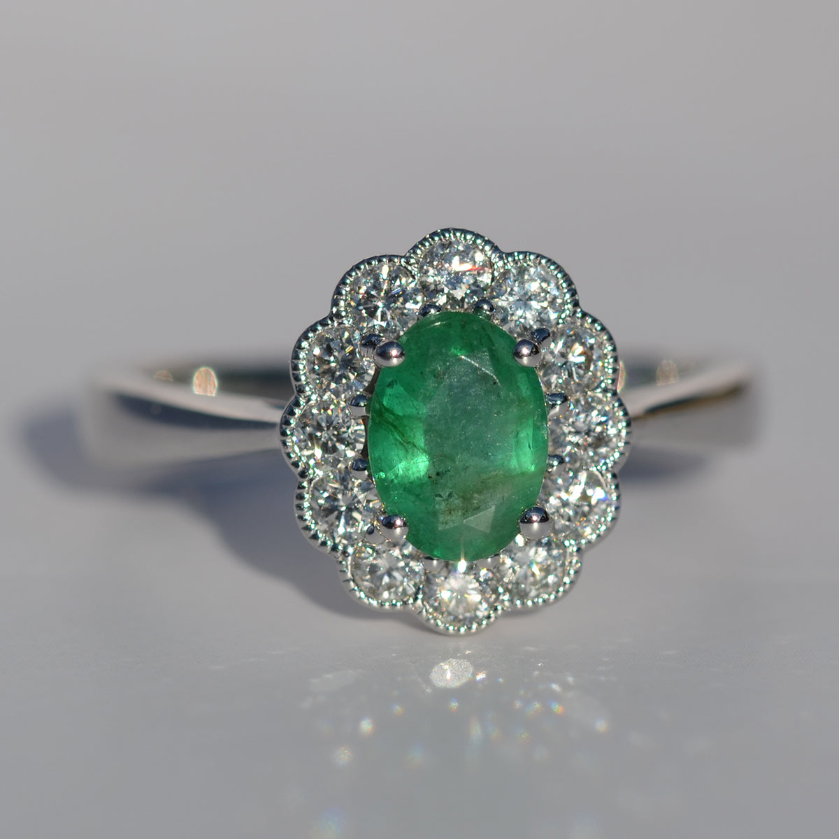 18ct White Gold Emerald & Diamond Oval Cluster Ring